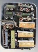 20th century tin plate locomotives and passenger cars.