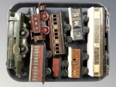 20th century tin plate locomotives and passenger cars.