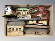 A group of tin plate model railway station platforms and buildings