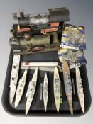 A group of scale model WWII battleships, two model locomotives, etc.