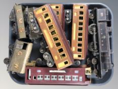 A group of 20th century tin plate locomotives and passenger cars.