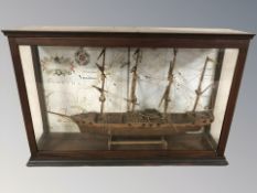 A scale model four masted sailing ship in display case, width 52 cm.