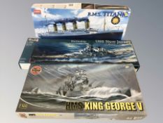 Three naval modelling kits by Airfix, Revell and Academy.