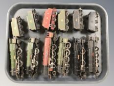 A group of 20th century tin plate locomotives and passenger cars including Hornby.