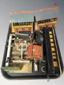 A group of tin plate model railway buildings and other decorations, passenger car, etc.