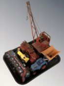 A Japanese tin plate locomotive, further model crane, fire engine, etc.