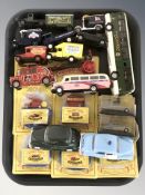 Boxed and unboxed die cast delivery vans and other vehicles including Corgi.