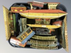 Assorted tin plate railway track, station platforms and buildings.