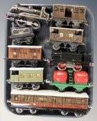20th century tin plate locomotives passenger cars including wind up examples.