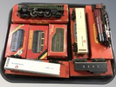 A group of Triang OO gauge die cast locomotives and other rolling stock, in boxes.