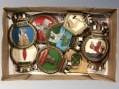 A group of painted plaques and crests