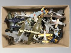 A group of die cast scale model aircraft.