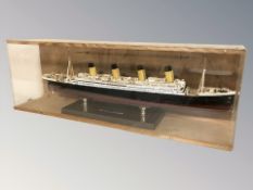 A scale model of The RMS Titanic in perspex case,