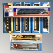 Seven various OO gauge locomotives and passenger cars including Airfix and Bachmann.