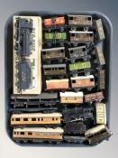 Assorted 20th century tin plate locomotives and other rolling stock.