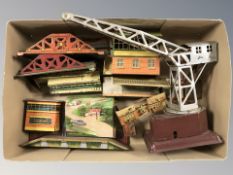 A group of tin plate model railway station platforms and buildings