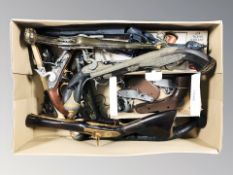 A quantity of decorative fantasy flintlock pistols.