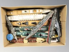 A group of scale model WWII battleships and oceanliners.