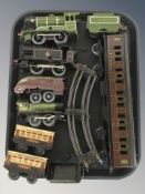20th century tin plate locomotives, passenger cars, lengths of track, etc.