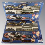 Two Toy Tech train sets in boxes