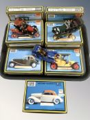 Nine Dapol Highway Pioneers scale model cars in boxes.