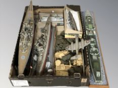 A group of scale model battleships, military vehicles, aircraft, etc.
