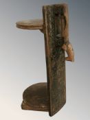 A Scandinavian rustic carved oak two tier stand with horse handle, height 60 cm.