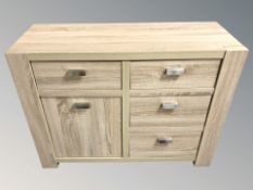 A modern laminated sideboard, 107 cm x 41 cm x 80 cm.