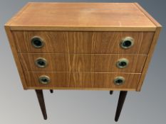 A Scandinavian teak pine and mdf three drawer chest,