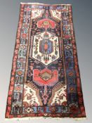 A Hamadan rug, North-West Iran, 225 cm x 111 cm.