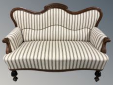 A late 19th century Continental walnut salon settee 145 cm long x 72 cm deep x 89 cm high