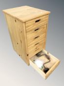 A pine six drawer chest containing assorted hand tools.
