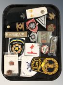 A group of reproduction military and police insignia.