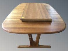 A Scandinavian extending dining table with two leaves,