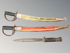 A German K98 bayonet and two reproduction Indian short swords