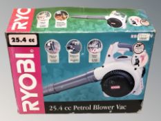 A Ryobi petrol blower garden vacuum in box