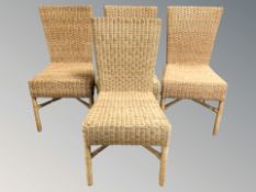 A set of four wicker chairs