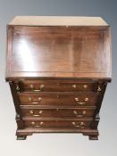 A reproduction mahogany fall front bureau, 75 cm W x 54 cm D x 105 cm H.