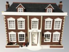 A contemporary doll's house, with furnished interior, 97 cm W x 46 cm D x 69 cm H,