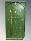 A Chad Valley bagatelle board, length 77 cm.