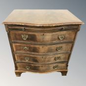 A reproduction mahogany serpentine front four drawer bracket chest, 70 cm W x 49 cm D x 77 cm H.