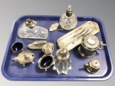 A group of atomisers, cruet, silver handled items,