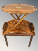 Two butler's tray tables, largest 70 cm wide.