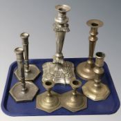 A group of brass and EPNS candlesticks.
