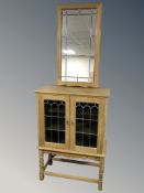 A Danish blond oak and leaded glass double door side cabinet,