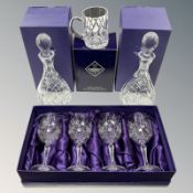 A pair of Edinburgh crystal decanters, height 31 cm, a tankard and a set of four wine glasses,