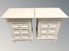 A pair of modern cream three drawer bedside chests, width 48 cm.