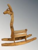 A 20th century pine rocking horse, length 102 cm.