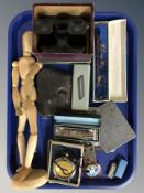 A group of harmonicas / mouth organs, a Viewmaster, wooden articulated doll, voltmeter, etc.