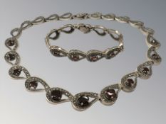 A silver-gilt marcasite and garnet necklace and bracelet CONDITION REPORT: 70g